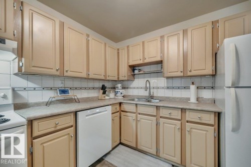 204 2620 Mill Woods Road E, Edmonton, AB - Indoor Photo Showing Kitchen With Double Sink