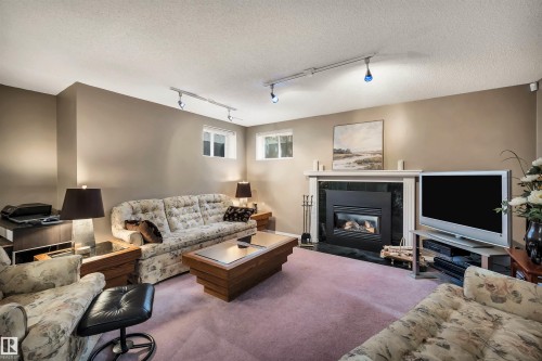 11239 12 Avenue, Edmonton, AB - Indoor Photo Showing Living Room With Fireplace