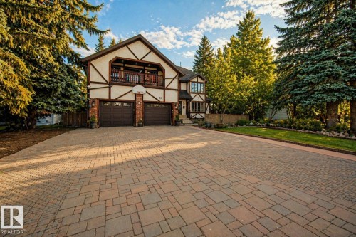 Tudor Revival-style exterior featuring stucco and exposed timber detailing - 33 Glen Meadow Crescent, St. Albert, AB - Outdoor