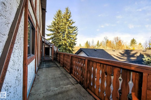 Exterior balcony featuring a concrete surface and a decorative wood railing - 33 Glen Meadow Crescent, St. Albert, AB - Outdoor