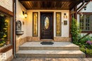 Inviting entrance featuring a dark wood-finish door with an oval glass insert, flanked by vertical sidelight windows - 33 Glen Meadow Crescent, St. Albert, AB  - Outdoor With Deck Patio Veranda With Exterior 