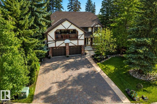 Tudor-style exterior featuring a prominent gabled roof and decorative half-timbering - 33 Glen Meadow Crescent, St. Albert, AB - Outdoor With Deck Patio Veranda