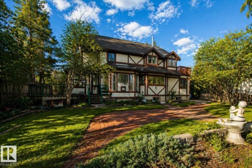 Tudor-style exterior with exposed timber framing and multiple bay windows - 33 Glen Meadow Crescent, St. Albert, AB - Outdoor With Deck Patio Veranda