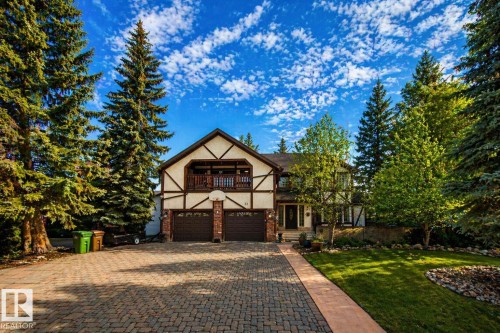 Tudor-style residence with a two-car garage, upper-level balcony, and a paver driveway - 33 Glen Meadow Crescent, St. Albert, AB - Outdoor