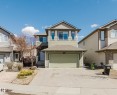 Two-story property featuring a front-facing attached garage and a concrete driveway - 611 176 Street, Edmonton, AB  - Outdoor With Facade 