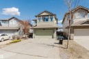 Two-story home with a two-car attached garage, light green siding, and contrasting trim - 611 176 Street, Edmonton, AB  - Outdoor With Facade 