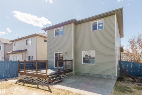 Expansive wood deck with dark railing, featuring lattice skirting and steps - 611 176 Street, Edmonton, AB - Outdoor With Deck Patio Veranda With Exterior