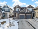This property features a two-story exterior with a two-car garage and a paved driveway - 2118 52A Street, Edmonton, AB  - Outdoor With Facade 