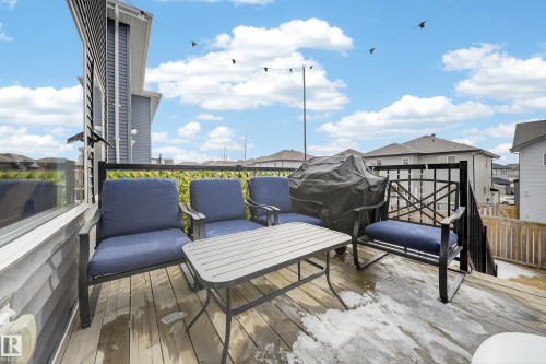 Outdoor deck area with wood flooring and dark railing - 2118 52A Street, Edmonton, AB - Outdoor