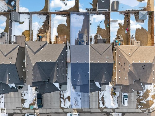 Aerial view of the property, featuring a paved driveway, and a partially snow-covered backyard - 2118 52A Street, Edmonton, AB - Outdoor With View