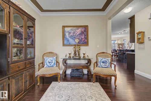 Hardwood-style flooring throughout - 805 Hodgins Road, Edmonton, AB - Indoor Photo Showing Other Room