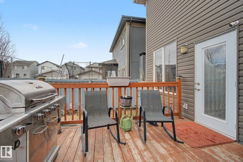 Spacious wood-finish deck with a wooden railing - 805 Hodgins Road, Edmonton, AB - Outdoor With Deck Patio Veranda With Exterior