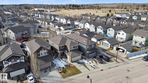 Residential neighborhood featuring multiple two-story homes with attached garages, shingled roofs, and varied exterior finishes - 805 Hodgins Road, Edmonton, AB - Outdoor