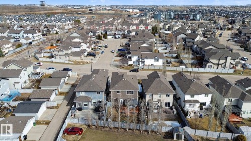 Residential neighborhood featuring a mix of detached and semi-detached homes, asphalt shingle roofs, and fenced rear yards - 805 Hodgins Road, Edmonton, AB - Outdoor With View