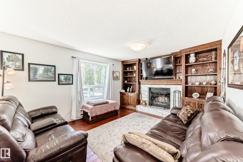 84 Jefferson Road, Edmonton, AB - Indoor Photo Showing Living Room With Fireplace