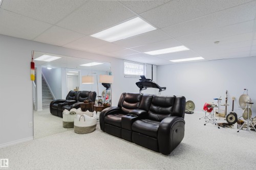 Versatile finished lower level featuring wall-to-wall carpeting, recessed lighting, and a drop ceiling - 19 1659 Jamha Road, Edmonton, AB - Indoor Photo Showing Basement