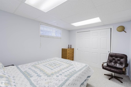 Room featuring light-colored walls, white trim, and a drop ceiling with recessed lighting panels - 19 1659 Jamha Road, Edmonton, AB - Indoor Photo Showing Bedroom