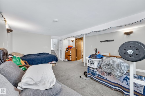 Carpeted lower level featuring painted walls and recessed lighting - 1 Greenwich Crescent, St. Albert, AB - Indoor