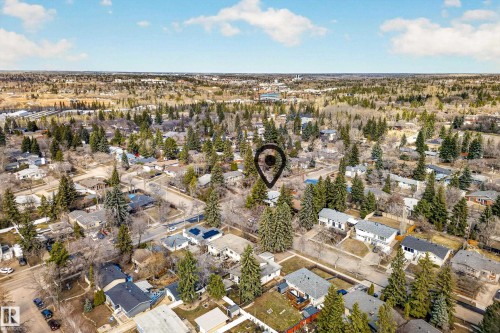 Residential neighborhood with mature trees, established properties, and distant green spaces - 1 Greenwich Crescent, St. Albert, AB - Outdoor With View