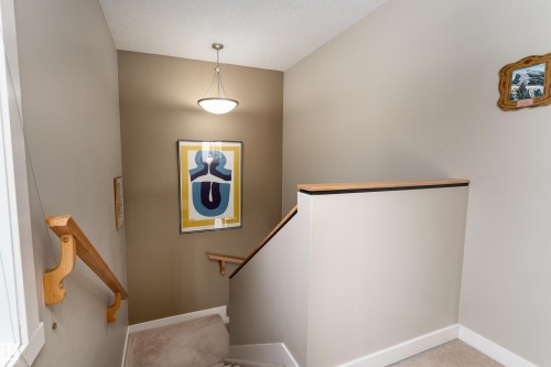 Staircase with baseboards and carpet flooring - 10906 72 Avenue, Edmonton, AB - Indoor Photo Showing Other Room