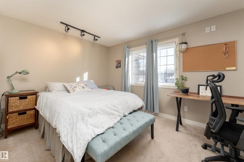 Bedroom featuring a desk, track lighting, and light carpet - 10906 72 Avenue, Edmonton, AB - Indoor Photo Showing Bedroom
