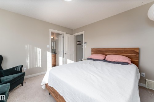 Bedroom with light carpet - 10906 72 Avenue, Edmonton, AB - Indoor Photo Showing Bedroom