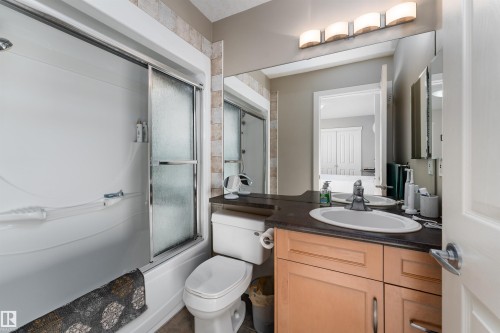 Full bathroom with vanity and bath / shower combo with glass door - 10906 72 Avenue, Edmonton, AB - Indoor Photo Showing Bathroom