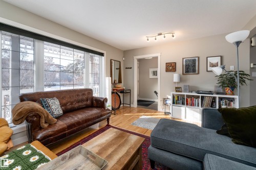 Living room with light wood-style floors - 10906 72 Avenue, Edmonton, AB - Indoor Photo Showing Living Room