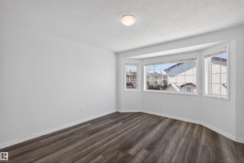 Expansive bay window featuring white trim and multiple panes - 6 1237 Carter Crest Road, Edmonton, AB 