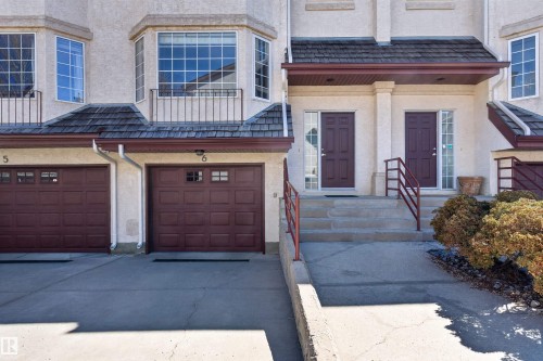 Townhouse exterior featuring a stucco finish and shingle roofing - 6 1237 Carter Crest Road, Edmonton, AB 