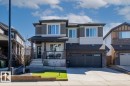 Contemporary two-story residence featuring a combination of horizontal siding, vertical accents, and stone veneer - 915 177 Street, Edmonton, AB  - Outdoor With Facade 