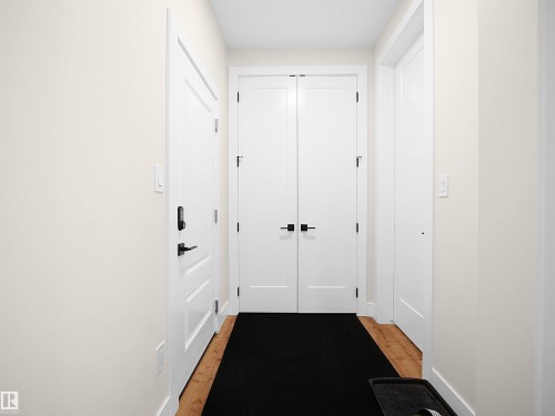 Entryway featuring light-toned walls and wood-finish flooring - 20827 130 Avenue Nw, Edmonton, AB - Indoor Photo Showing Other Room
