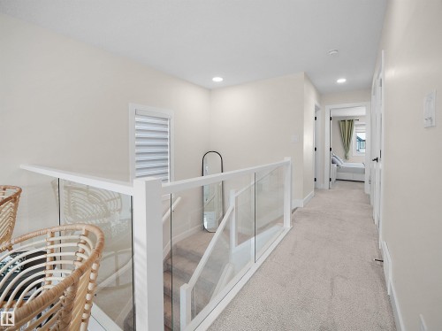 Upper-level hallway featuring light-toned carpeting and recessed lighting - 20827 130 Avenue Nw, Edmonton, AB - Indoor Photo Showing Other Room