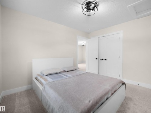 Light-colored walls complement plush carpeting - 20827 130 Avenue Nw, Edmonton, AB - Indoor Photo Showing Bedroom