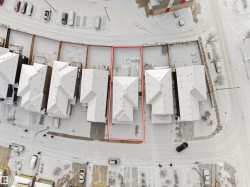 Aerial perspective of a multi-unit property with a gabled roofline - 