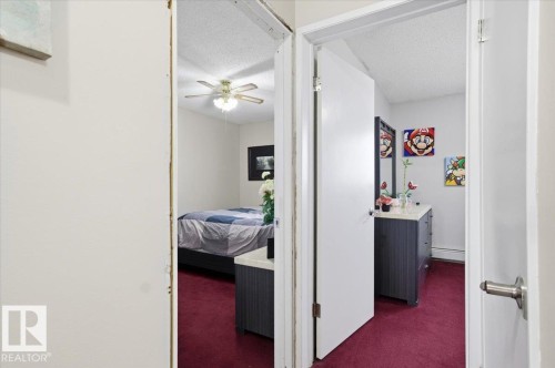 Two distinct rooms featuring red carpeting, white walls, and white ceilings - 6 3803 76 Street, Edmonton, AB - Indoor