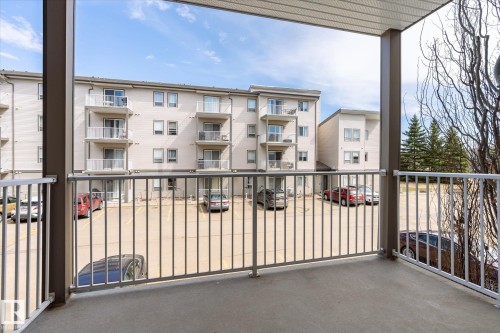 Private balcony featuring a concrete floor and metal railing - 203 155 Edwards Drive, Edmonton, AB - Outdoor With Balcony With Exterior