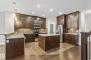 Kitchen featuring wood-finish cabinetry, stainless steel appliances, granite countertops, tile backsplash, and recessed lighting - 11106 76 Avenue, Edmonton, AB  - Indoor Photo Showing Kitchen With Stainless Steel Kitchen With Double Sink With Upgraded Kitchen 