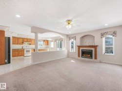 Living space with carpeting, a ceiling fan, and recessed lighting - 