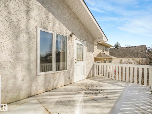 Outdoor deck featuring white railing and direct access to the interior - 1054 Ormsby Crescent, Edmonton, AB - Outdoor