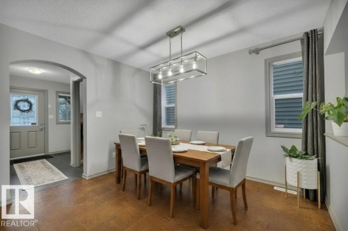 Virtually staged with table - 1611 63 Street, Edmonton, AB - Indoor Photo Showing Dining Room