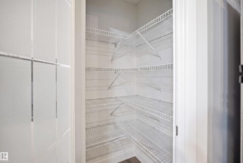 Spacious pantry featuring multiple levels of wire shelving for organized storage - 3545 11 Street, Edmonton, AB - Indoor With Storage