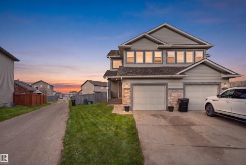 Contemporary residence featuring a light-toned siding exterior with stone accents - 3545 11 Street, Edmonton, AB - Outdoor