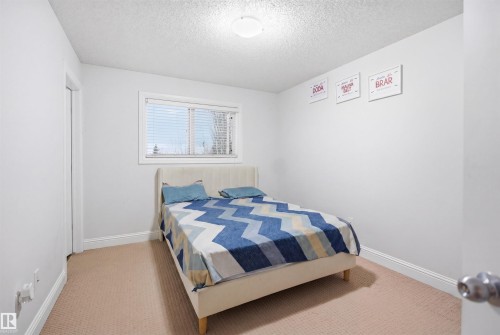 Room with neutral wall paint and light-toned carpeting - 3545 11 Street, Edmonton, AB - Indoor Photo Showing Bedroom