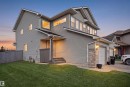 Gray siding exterior with multiple windows and an attached garage - 3545 11 Street, Edmonton, AB  - Outdoor 