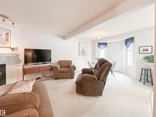 3 10 Devon Close, St. Albert, AB - Indoor Photo Showing Living Room With Fireplace