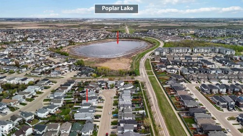 Aerial perspective showcasing a residential area with a prominent central lake feature - 17224 83 Street, Edmonton, AB - Outdoor With View