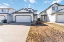 Two-story residence featuring white siding with dark trim, an attached two-car garage, and a concrete driveway - 17224 83 Street, Edmonton, AB  - Outdoor With Facade 