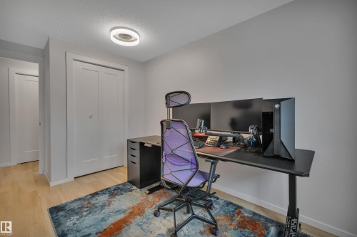 This room features light-colored flooring and light-toned walls, creating a bright atmosphere - 585 Knottwood Road W, Edmonton, AB - Indoor Photo Showing Office