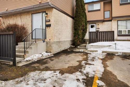Exterior view of the property, featuring a private entrance with steps and a handrail - 585 Knottwood Road W, Edmonton, AB - Outdoor